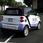 4_vehiclewrap_smartcar_anytimefitness_iconography